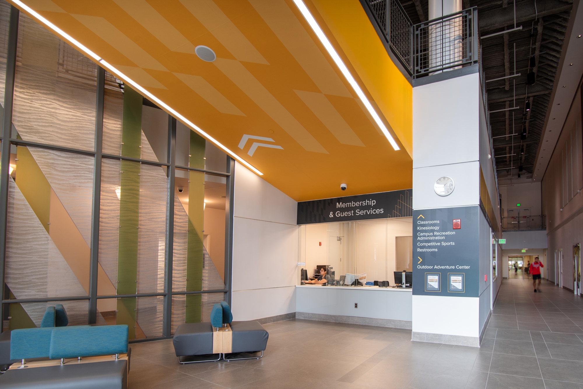 Amplify custom wallcovering applied to the ceiling in a college building reception area.
